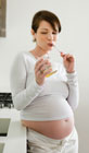 pregnant woman eating honey